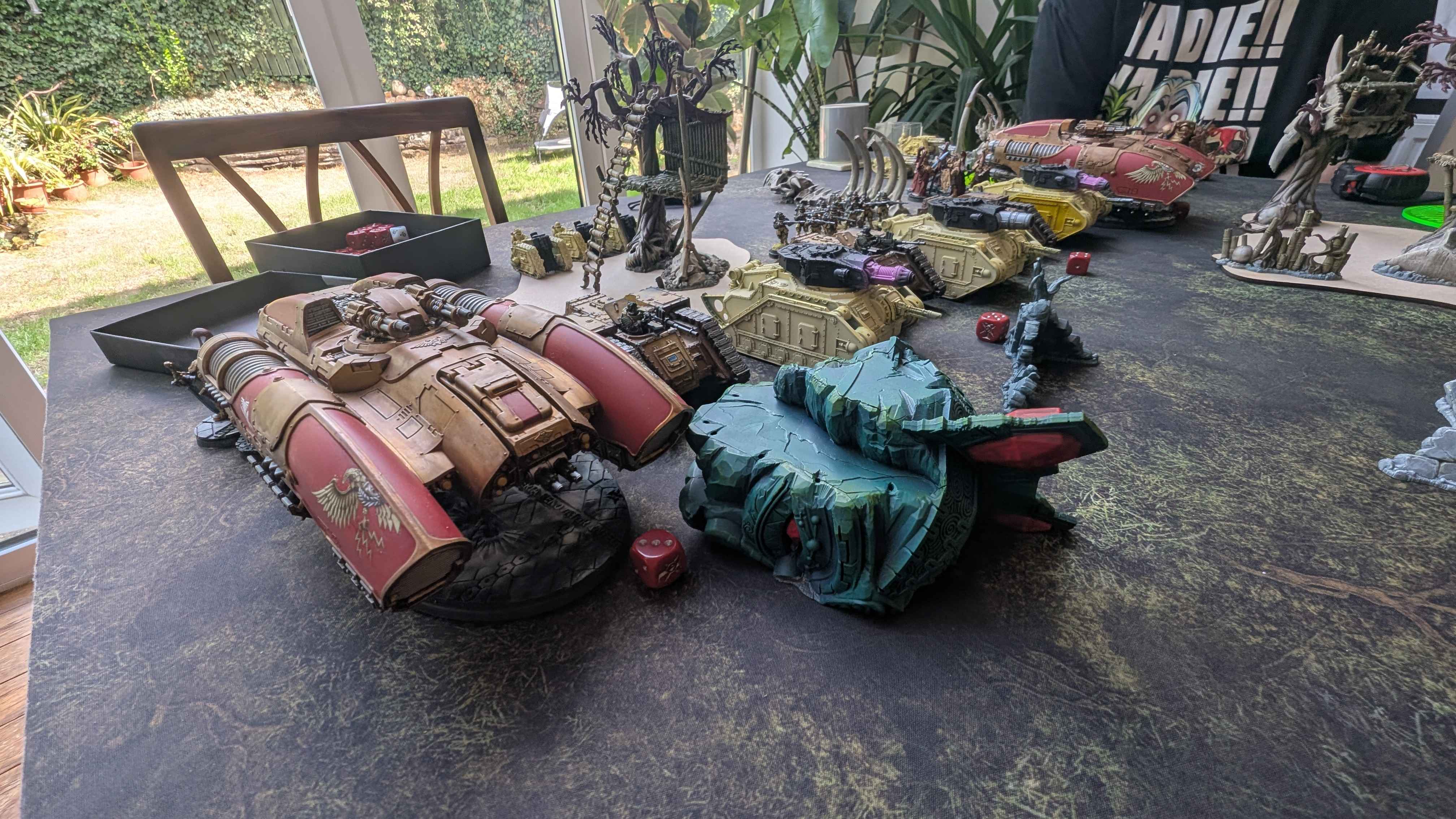 A long armoured column of cream-liveried Solar Auxilia tanks deployed across the table
